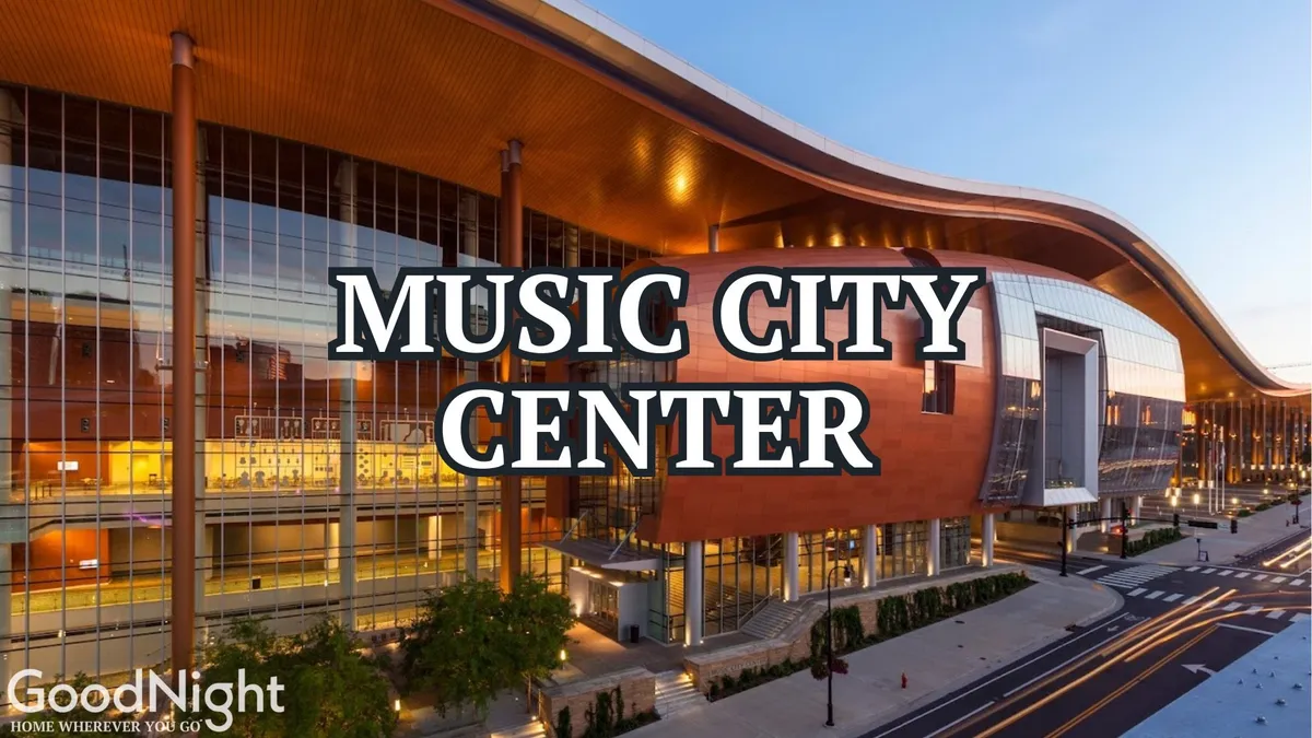 This image showcases the distinctive, modern exterior of the Music City Center in downtown Nashville, with its sweeping curved roof and landscaped entryway. The setting is lively and inviting, indicating a bustling urban environment ideal for business and networking events.